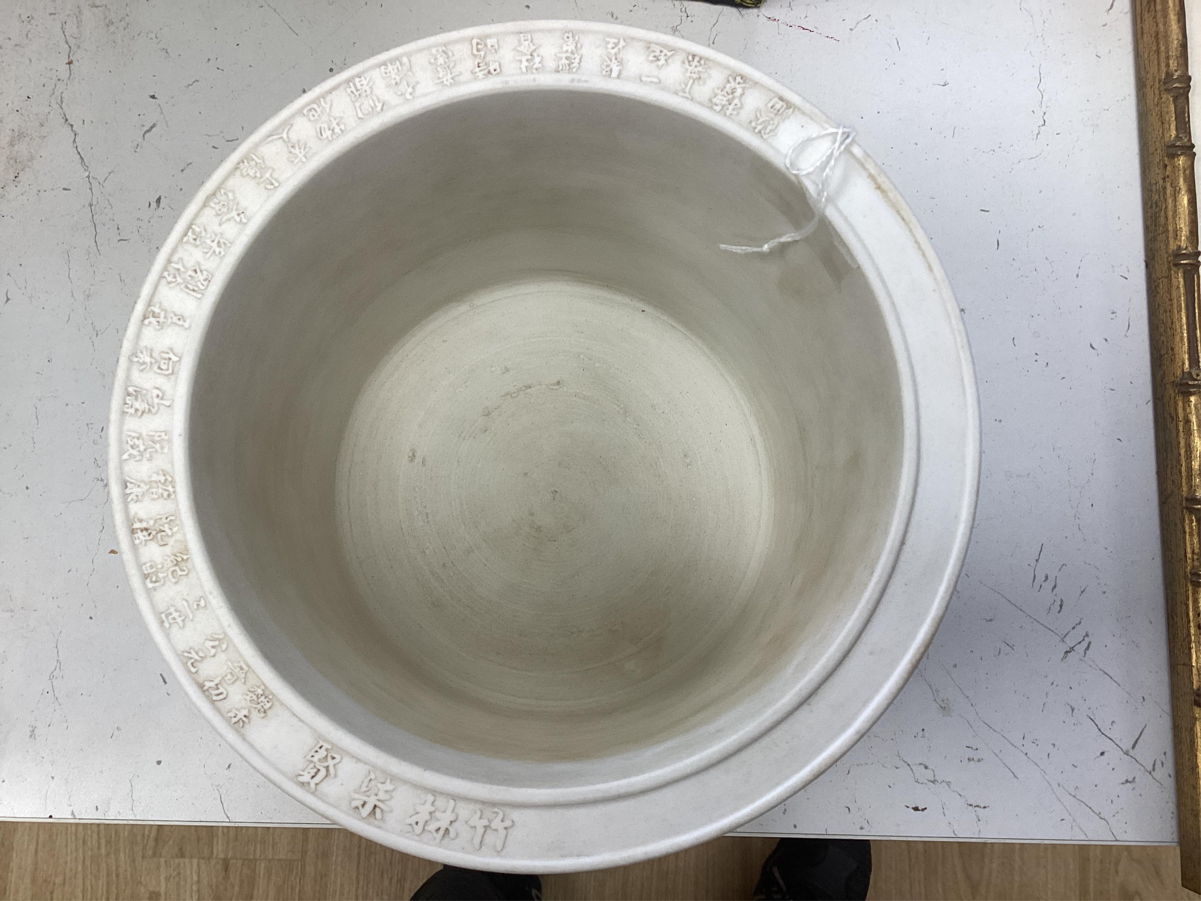 A Chinese biscuit porcelain ‘scholars’ brushpot, Daoguang mark but later, 17cm. Condition - fair to good